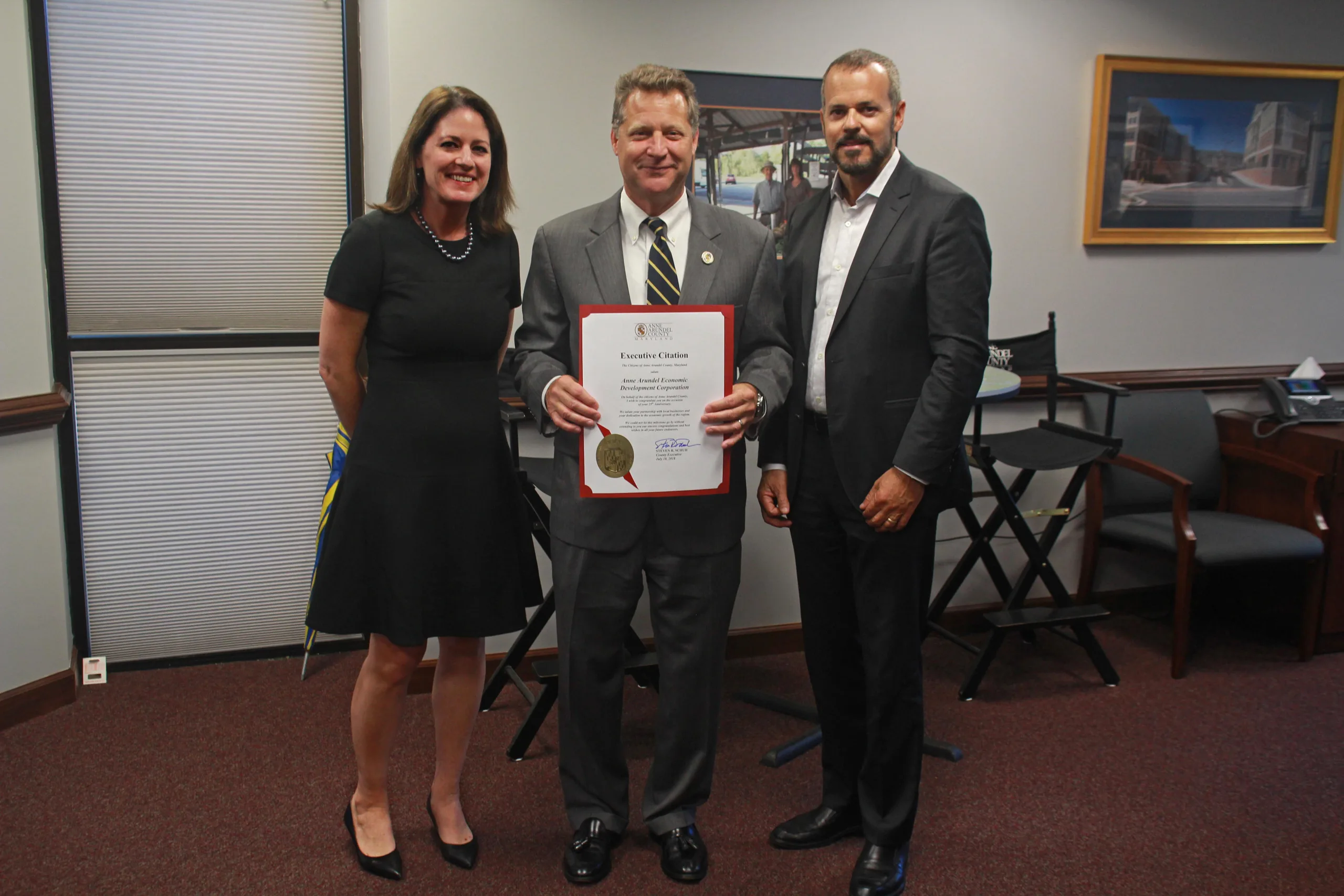 County Executive Steve Schuh presents a 25 year citation to AAEDC CEO Julie Mussog and Vice-Chairman Paul Gable