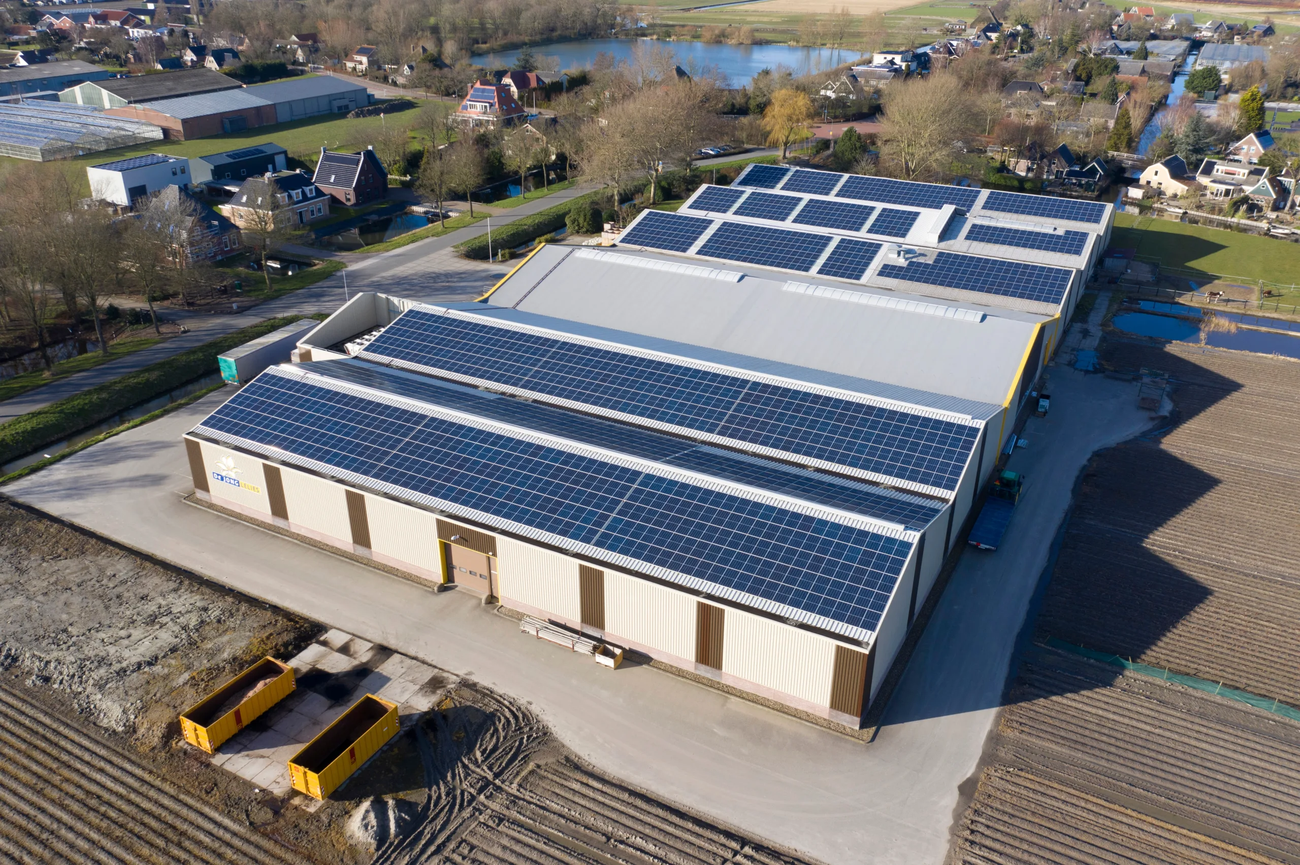 Drone,Photo,Of,Modern,Solar,Panels,On,A,Commercial,Building.
